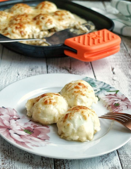 Huevos rellenos gratinados