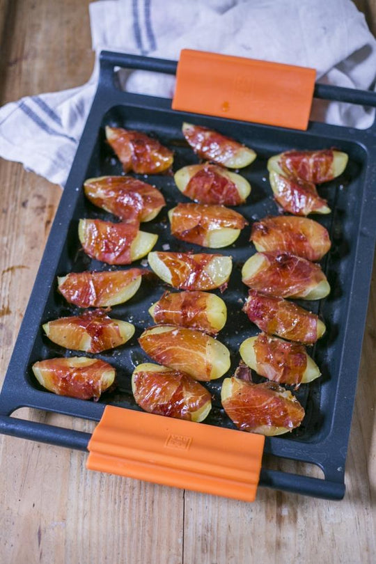 Patatas envueltas en jamón de jabugo con jarabe de arce